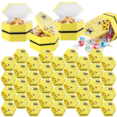 PRICES MAY VARY. Package Included: you will get 50 pieces beehive favor boxes and 1 roll of double side tapes, comes in flat paper state, assemble required, ensuring you have enough treat boxes to cater for most of your guests during parties, weddings, baby showers, or many other significant celebration Unique Hexagonal Design: our bee baby shower gift box has a unique hexagonal design after folding; The surface of the box is mainly yellow and black, with bees, honeycombs and flowers printed on Bees Theme Party, Bee Party Decorations, Resident Events, Honey Bee Baby Shower, Baby Shower Gift Box, Children Outfits, Bee Birthday Party, Hexagonal Design, Bee Baby Shower Theme