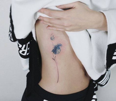 Blue poppy tattoo on the right ribcage. Blue Poppy Flower Tattoo, Blue Poppy Tattoo, Flower Tattoo Ribs, Small Poppy Flower Tattoo, Small Nature Tattoo, Blue Flower Tattoos, Tattoo Ribs, Tiny Flower Tattoos, Poppy Flower Tattoo