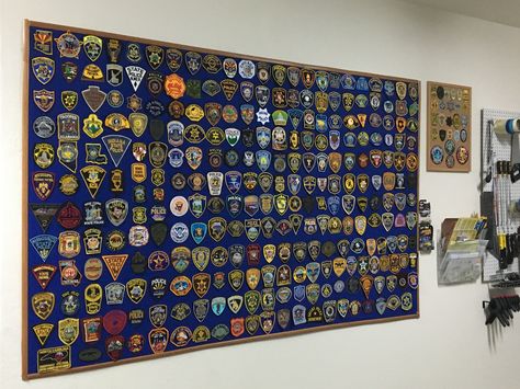 DIY patch board; cardboard, fabric, trim/molding, spray adhesive, finishing nails, staples. Police Patch Display Ideas, Police Patches Display, Patch Display, Patches Display, Diy Patch, Patch Collection, Collection Ideas, Trim Molding, Police Patches