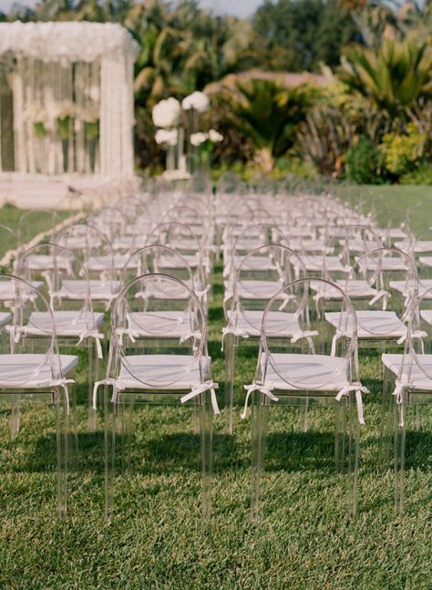 Ghost chairs brought such a stylish touch to the lush green lawn at a @Four Seasons Resort the Biltmore Santa Barbara garden wedding. Ghost Chair Wedding, Jeff Leatham, Chairs Wedding, Lucite Chairs, Clear Chairs, Mindy Weiss, Ceremony Chairs, Ghost Chairs, Ceremony Design