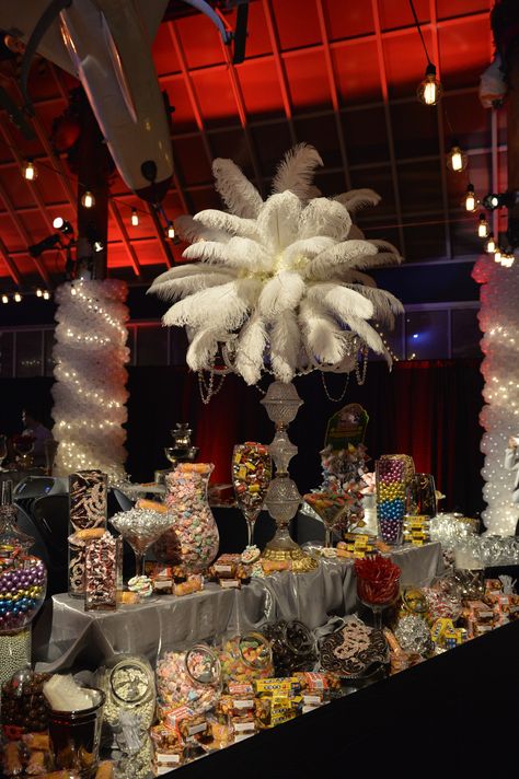 Feathered Centerpieces - Great Gatsby theme #events Gatsby Masquerade Party, Masquerade Candy Table Ideas, Gatsby Themed Dessert Table, Feathered Centerpieces, Centerpieces Masquerade, Great Gatsby Candy Table, Great Gatsby Tables, Sweeteasy Gatsby Party, Gatsby Corporate Event