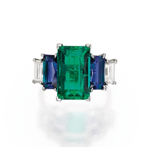 PLATINUM, EMERALD, SAPPHIRE AND DIAMOND RING. Centered by a rectangular step-cut emerald weighing 7.09 carats, flanked by two rectangular step-cut sapphires weighing 2.01 and 1.91 carats, further accented by two baguette diamonds weighing approximately .90 carat, size 6. Bijoux Art Nouveau, Emerald Rings, Sapphire And Diamond Ring, Emerald Engagement, Emerald Jewelry, Art Deco Ring, Gems Jewelry, Love Ring, Dream Jewelry