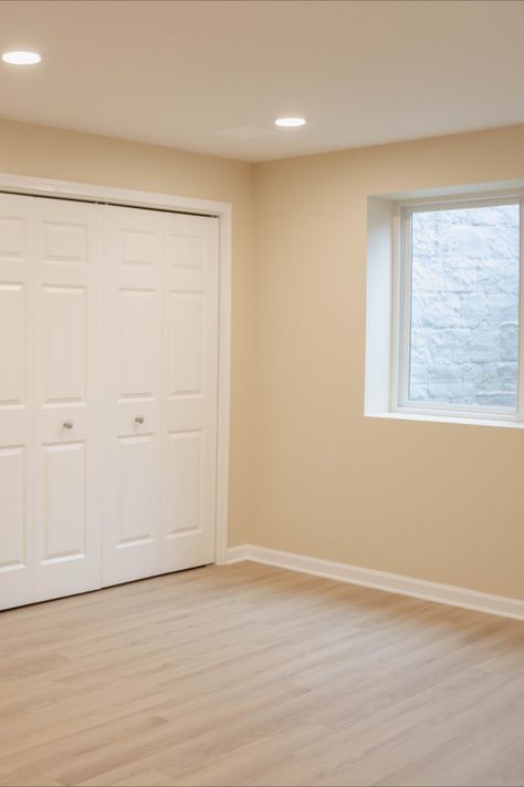 Bright & Welcoming bedroom in finished basement with Egress window painted with Sherwin Williams chopsticks super paint. Sherwin Williams Chopsticks, Paint Color For Basement With No Windows, Lightwell Basement, Basement Paint Colors To Brighten, Drylock Basement Paint, Partial Basement Finish, Finished Basement Designs, Egress Window, Basement Design