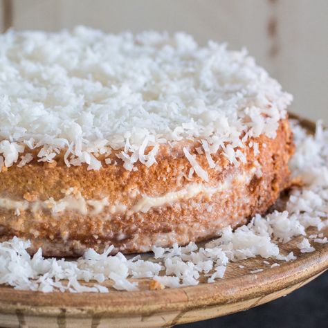 This super moist coconut cake is the perfect excuse to linger around the dinner table a little longer, enjoying some coffee and the company of friends! Brazil Recipes, Moist Coconut Cake, Brazilian Recipes, Brazilian Desserts, Brazilian Dishes, Portuguese Desserts, Coconut Cake Recipe, Coconut Recipes, Brazilian Food