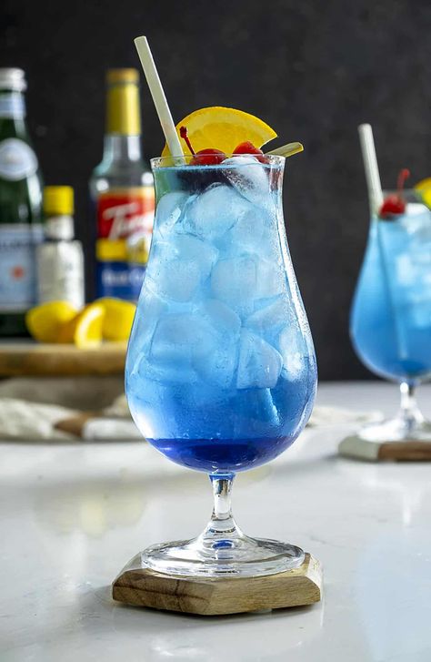 Blue Lagoon Cocktail, Mocktail Party, Easy Mocktails, Strawberry Simple Syrup, Easy Mocktail Recipes, Blue Drink, Basil Lemonade, Party Snacks Easy, Coconut Drinks