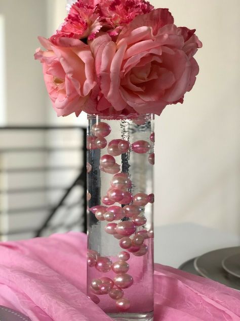 Pink And Blush Pink Vase Filler Pearls. Beautiful ombre/watercolor pearls. Pearls do not have holes. Package contains 90pcs mix size pearls ranging from 10mm, 14mm, 18mm. Usage for: Wine glass fillers, mason jar fillers, table confetti, craft projects. Create beautiful floating pearl centerpiece (see photo) by adding transparent gel beads. **Please note, pearls do not float by itself.  Transparent gel beads are required and is sold separately to create the floating pearl decorations.  Pearls wil Pearl Centerpieces, Centerpieces For Wedding, Quinceanera Centerpieces, Quinceanera Pink, Pink Sweet 16, Jar Fillers, Pink Centerpieces, Pearl Centerpiece, Valentine Centerpieces