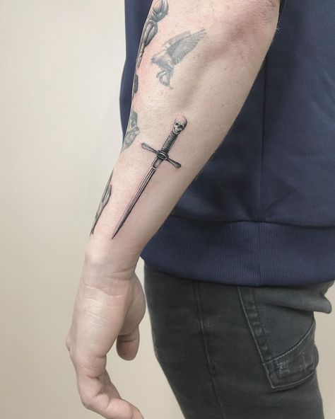 Tattoo Swords Men Arm, Swords Tattoo Men Forearm, Forearm Tattoo Swords, Broadsword Tattoo, Men Forearm Tattoos Simple, Tattoo Swords Men, Dagger Tattoo Forearm, Men Tattoo Ideas Forearm, Forearm Dagger Tattoo