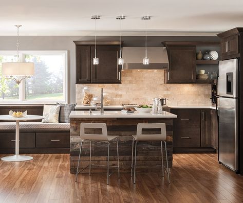 Instead of color, use texture to create a mood. A brickwork backsplash, reclaimed lumber, and intense grain in the wood floor all work together and look amazing against the dark Maple cabinets. Dover's transitional style is perfect as a backdrop for these rich and varied textures. Dark Maple Cabinets, Office With Built Ins, Maple Kitchen Island, Homecrest Cabinets, Home Office With Built Ins, Kitchen Colors Ideas, Condo Kitchen Ideas, Stock Cabinet, Sink Table