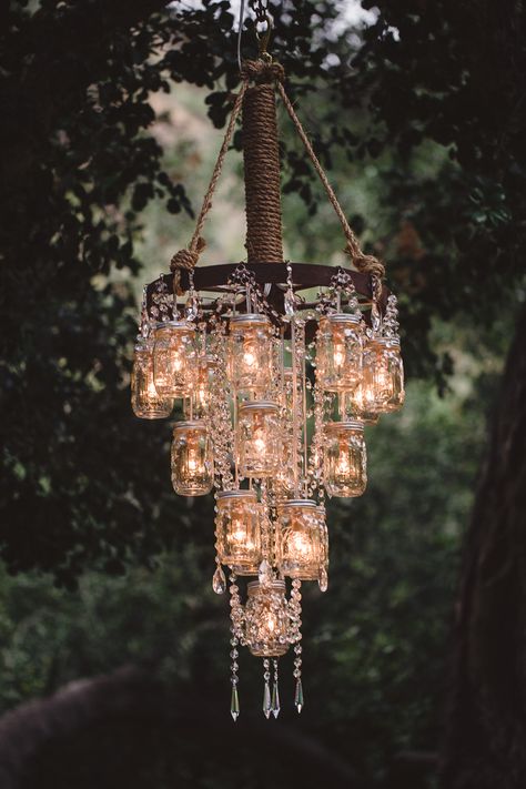 rustic bling!  I could do this with the mason jar/wagon wheel chandelier I made! ขวดโหล Mason Jar, Dekorasi Maroko, Chandelier Wedding Decor, Luminaria Diy, Jar Chandelier, Mason Jar Chandelier, Diy Lampe, Wedding Chandelier, Rustic Mason Jars