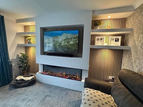 Simply beautiful!😍 Featuring the 1500 slim electric fire from @firezfires , slat wall panelling finished in natural oak and dimmable downlighting to suit any mood, this media wall has completely transformed the main living area of this lovely family home🏡 To find out more about how we could make your dream space a reality simply visit our website: 🌍 www.tynesidehome.co.uk Call into our Hebburn showroom at: 🏠75 Station road, NE31 1LA Or contact a member of our team on: 📧 enquiries@tyne... Slat Media Wall, Media Wall Paneling, Oak Slat Wall, Media Walls, Electric Fire, Wall Panelling, Lovely Family, Electric Fires, Media Wall