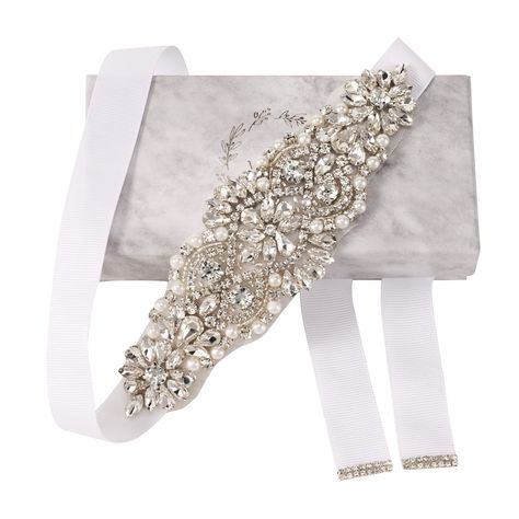 PRICES MAY VARY. Floral Rhinestone Belt: The handmade embellished bridal belt in silver is adorned with flower-shaped clusters of crystals. 100"L, 6"L embellishment: The length of the embellishment is 6.69 inches with a max width of about 2 inches at the widest point. The design tapers towards the edges and finished with white ribbed tie on either ends. The total length of the wedding dress belts with rhinestones is 3 yards. Acrylic: The embellished clear rhinestone and crystals are made of envi Plain Wedding Dress, Bridal Sash Belt, Wedding Dress Belt, Rhinestone Belt, Rose Gold Crystal, Wedding Sash Belt, Sash Belts, Wedding Sash, Wedding Belts