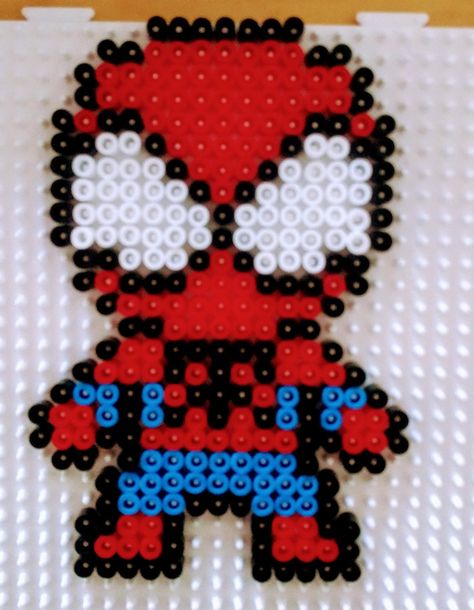 Spiderman beads #perleshama Peeler Bead Spiderman, Spiderman Beads Pattern, Perler Beads Ideas Spiderman, Spiderman Melty Beads, Iron Beads Spiderman, Pyssla Ideas Spiderman, Spiderman Bead Pattern, Spiderman Pearl Beads, Spider Man Perler Bead Pattern