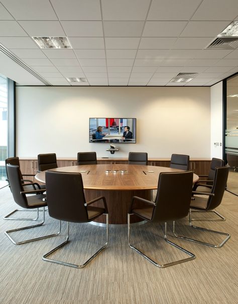 Board Room >> Circular Meeting Room Table >> This round wooden table in the boardroom at Amey creates a perfect collaborative space for colleagues. People often prefer the increased eye-contact you get when seated at a round table, and the more egalitarian nature of not having someone sitting at the head of the table. See more of the collaboration areas and meeting spaces we created at Amey on our website... Conference Room Round Table, Circular Office Table, Board Room Design Office, Round Table Meeting Room, Office Round Table, Round Table Office, Board Room Design, Round Office Table, Round Meeting Table