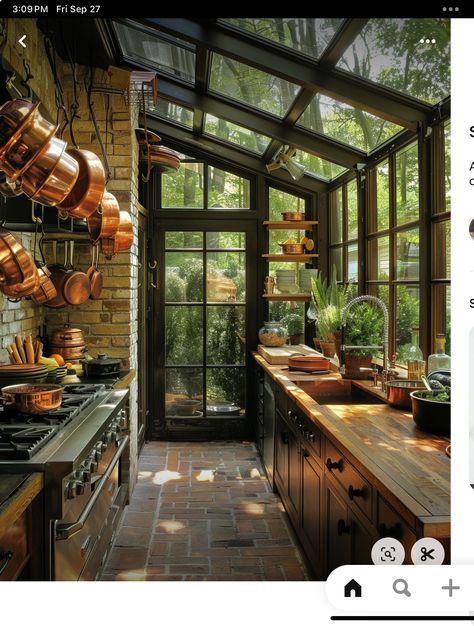 Kitchen Into Sunroom, Sunken Sunroom Off Kitchen, Kitchen Overlooking Garden, Kitchen With Huge Window, Greenhouse Kitchen Extension, Hanging Copper Pots, Green House Kitchen, Kitchen With Windows, Kitchen Veranda