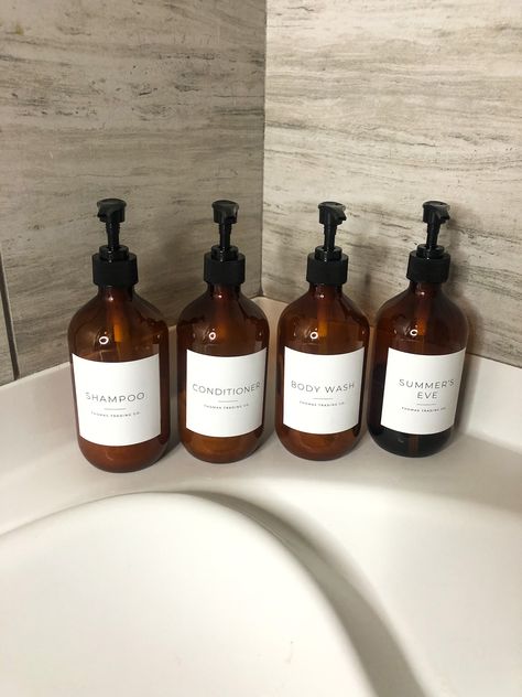 DIY: How To Upgrade Your Bathroom With Custom Toiletry Bottles | Melanie Mineau Morning Show Host Amber Bottles Bathroom, Glass Soap Dispenser Bathroom, Renter Friendly Decorating, Melanie Thomas, Bathroom Dispensers, Bedroom Furniture Makeover, Glass Soap Dispenser, Old Bathroom, Brown Bottles