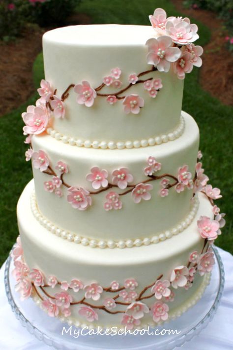 Cherry Blossom Cake | by Mycakeschool.com Cherry Blossom Wedding Cake, Cake Design Tutorial, Cherry Blossom Cake, Cherry Blossom Wedding, Tiered Cake, Cake Decorating Videos, Fondant Flowers, Cake Videos, Cupcake Cake