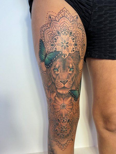 Lion Tatoos Woman Thigh, Lioness Tattoo For Women Leg, Butterfly And Lion Tattoo, Lion With Mandala Tattoo Design, Lion Knee Tattoo, Lion Leg Tattoo Female, Lion Tattoo Thigh, Female Knee Tattoos, Half Leg Sleeves For Females