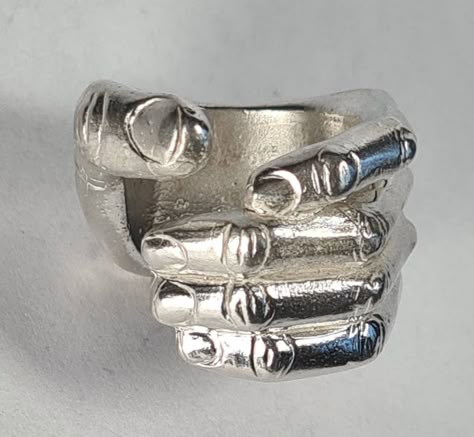 **Please note that we dispatch on Tuesdays unless special delivery express option is paid for** Sterling silver 'hand ring'. Original design carved in wax then lost wax cast into sterling silver.  Very large piece which weighs approximately 42g in silver.  A significant size adjustment may alter the appearance. PLEASE NOTE THE PHOTO ON THE WOMAN IN THE REVIEW IS A SIZE J AND TO MAKE IT LOOK LIKE THAT AT A LARGER SIZE WILL REQUIRE A £40 SUPPLEMENT. Please contact us to discuss.  First class recor Wax Cast Rings, Wax Jewelry, Lost Wax Ring, Hand Shaped Ring, Lost Wax Casting Rings, Wax Carved Ring, Lost Wax Jewelry, Space Rings, Hand Ring