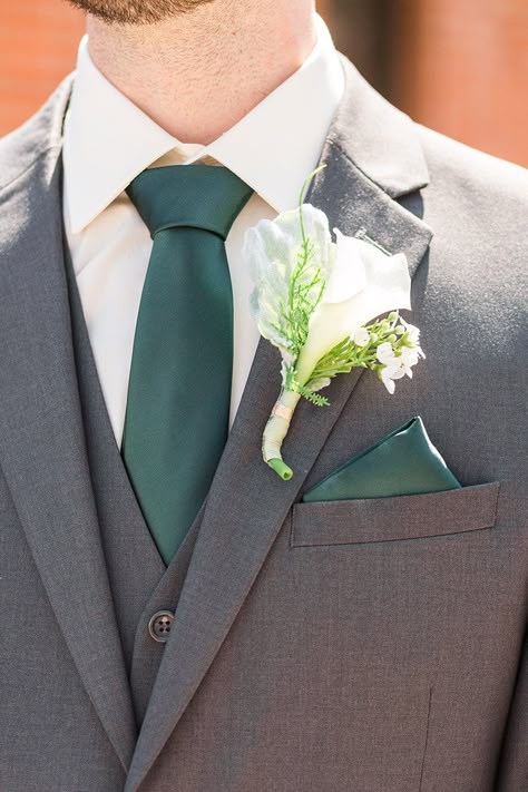 Emerald Green Groomswear and Boutonniere Grey And Emerald Green Suit, Groomsmen In Emerald Green, Suits With Emerald Green, Tux To Match Emerald Green Prom Dress, Green Prom Tuxedo Ideas, Suits To Go With Green Dress, Grey Suit Wedding Emerald Green, Charcoal Grey Suit Emerald Green Tie, Dark Grey Suit With Emerald Green Tie