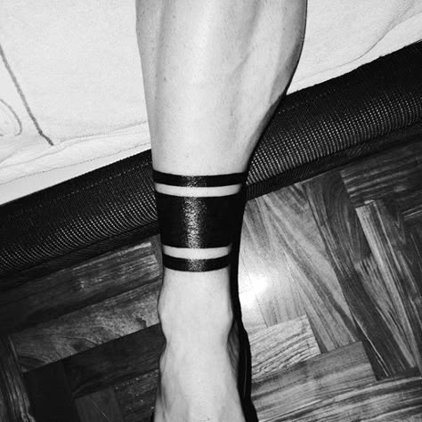 Guys Ankle Band Tattoo Blackwork Deisgns Band Tattoo Meaning, Black Band Tattoo, Ankle Band Tattoo, Ankle Tattoo Men, Leg Band Tattoos, Small Watercolor Tattoo, Band Tattoos For Men, Tattoo Band, Band Tattoos