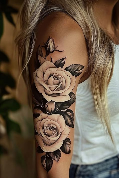 A woman’s upper arm adorned with two large, beautifully shaded roses, highlighting feminine strength and elegance. Women And Flowers Tattoo, Ladies Arm Sleeve Tattoo Ideas, Rose And Faith Tattoo, Bold Rose Tattoo, Floral Tatoos Woman Arm, Large Hand Tattoos For Women, Rose Cluster Tattoo, Rose With Crown Tattoo, Crown And Flower Tattoo