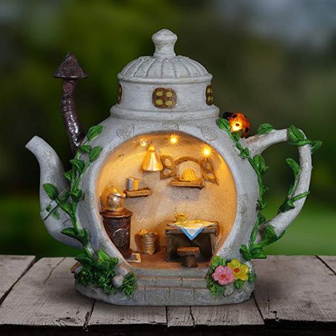 Amazon.com : Exhart Fairy Teapot Kitchen Garden Statue - Miniature Teapot House Solar Resin Statue in Hand-Painted Colors - Whimsical Teapot Home Decor w/Solar Accent Light for a Lovely Fairy Garden, 6" x 9" : Garden & Outdoor Solar Fairy House, Teapot House, Fairy Garden Cottage, Solar Yard Art, Fairy House Kit, Kitchen Scene, Fairy Garden Doors, Fairy Garden Houses, Garden Statue