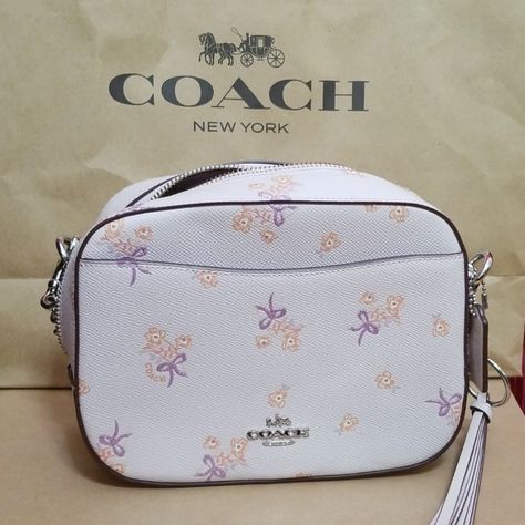 Nwt Very Feminine Coach Camera Bag. Lilac With Shimmery Ribbons. Chain And Leather Adjustable Straps With Coach Details. Front And Back Pocket On Outside. Zipper Pocket On One Side Of Interior And Open Slot Pocket On Other Side Of Interior. Very Cute Tassel Attached To The Decorative Silver Loop Adorning The Zipper. Dimensions Are 8.5 In 6.5 In X 3 In. So Many Unique Features! Coach New York, My Style Bags, Casual Style Outfits, Coach Bags, Zipper Pocket, Camera Bag, Adjustable Straps, Casual Style, Lilac