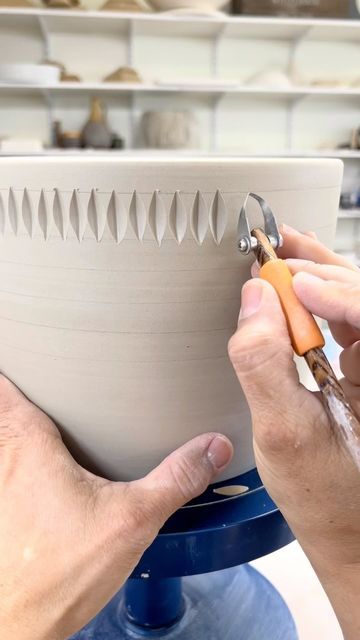 Juliette’s Wheelhouse on Instagram: "A few real time clips of carving a planter. I usually make all of the carved rows the same size but this time I had the shapes on each row get progressively longer. Let me know what you think. Tool used: @diamondcoretools P11 Curved Wide V Tip 12 mm Carving Tool . . . . . #pottery #diamondcoretools #lagunaclay #bmix #pottersofinstagram #carvedclay #studiopottery #madeintexas #wheelthrown #handmadepottery #workinprogress #functionalpottery #potterylove #pot Carving Pottery Ideas Patterns, Clay Carving Designs, Pottery Carving Ideas, Pottery Engobe, Carving Pottery, Pottery Carving, Laguna Clay, Clay Bowl, Pottery Tools