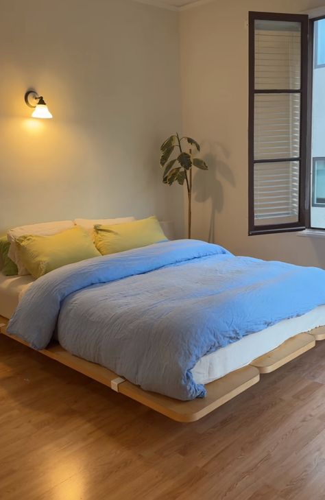 Bed On Box Spring On Floor, Simple Japandi Bedroom, Minimalist Mid Century Modern Bedroom, Double Window Bedroom, Bedroom With Angled Walls, Scandinavian Modern Bedroom, Asymmetrical Bedroom Layout, Bedroom With Colorful Accents, Floyd Bedroom