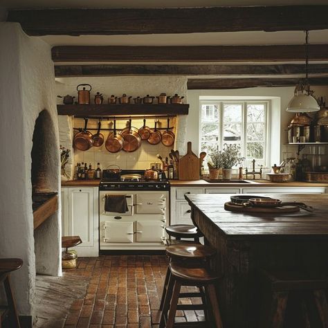 Cozy rustic kitchen with terracotta tiles, wooden beams, and copper pots hanging above Aga cooker. Aga Cooker Kitchen, Terracotta Floor Kitchen, Kitchen Terracotta Floor, Old Italian Kitchen, Kitchen With Terracotta Floor, Italian Style Kitchen, Aga Kitchen, Terracotta Floor Tiles, Terracotta Floors