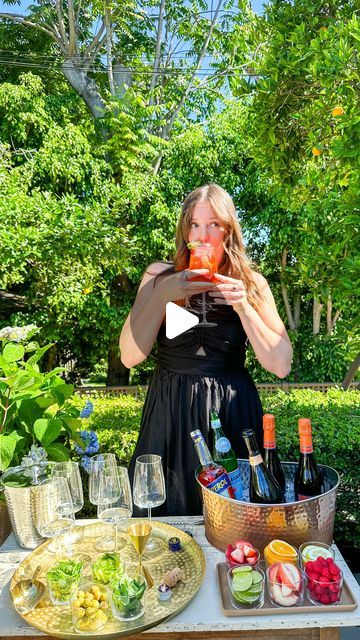 Elizabeth Van Lierde on Instagram: "DIY Spritz Bar! 🍊🫧🍾🥂🍓The holy grail of ‘bars’ as far as summer entertaining goes! Set up an easy DIY spritz bar with just a few simple staples and watch the party self start!   To setup a spritz bar you’ll need:   -A large ice bucket 🪣  -10 lbs of ice (for beverage bucket and for filling drinks!) 🧊 -6-8 wine glasses -Bottle of Aperol 🍊 -2-3 Bottles of Prosecco 🍾 -Soda Water 🫧 -4-6 Garnishes - orange slices, strawberries, olives, cucumber ribbons - whatever you like! 🥒🫒🍓🍊  Pro tip! I love buying large cheap beverage tubs like this at @homegoods , @marshalls and Thrift Stores!   Grab the full details with the link in my profile!   #summerentertaining #spritzseason #aperolspritz" Birthday Party Bar Ideas Drink Stations, Cucumber Ribbons, Spritz Bar, Large Ice Bucket, Drink Bucket, Beverage Tub, Soda Water, Drink Station, Party Bars