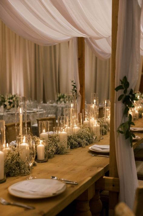 Romantic Tablescape Featuring Babys Breath and Candlelit Centerpieces | wedding planning checklist, wedding, wedding ideas, wedding decorations, wedding inspiration, wedding decorating, wedding designer, boho wedding decoration, wedding ceremony ideas, wedding reception ideas, wedding table, wedding day aesthetic, 2024 wedding trends, romantic candlelit wedding reception, candlelit tablescape, draping wedding decoration reception | #wedding #weddingreceptiondecor #weddingreceptioninspiration Candle Lit Wedding Reception, Draping Wedding Reception, Candlelit Tablescape, Romantic Candlelit Wedding, Candlelit Centerpieces, Wedding Reception Ideas Indoor, Candlelit Wedding Reception, Wedding Day Aesthetic, Candle Lit Reception