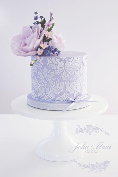 Lilac Floral Cake  with damask stencilling and decorated with whimsical sugar flowers - Cake by Julia Marie Cakes Birthday Cake Lilac, Lavender Colour Cake, Lavender Wedding Cake, Heart Birthday Cake, Julia Marie, Painted Wedding Cake, Sugar Flowers Cake, Heart Birthday, Elegant Birthday Cakes