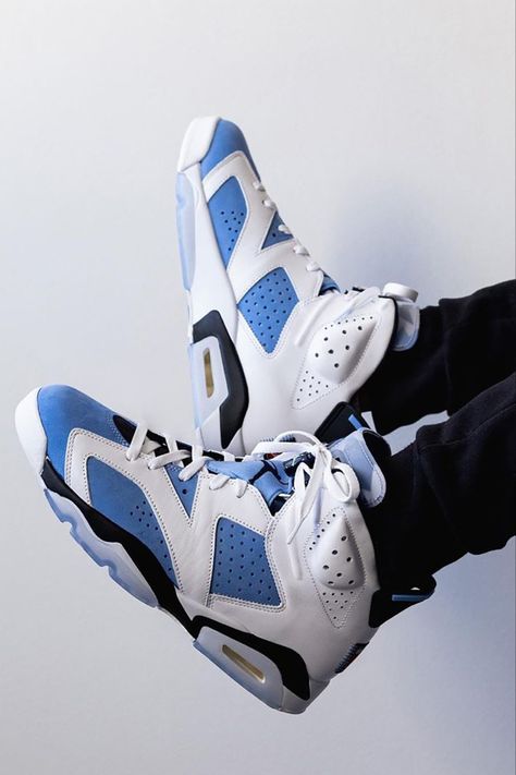 Inspired by Michael Jordan's alma mater, the Air Jordan 6 "UNC" variation features a ��“University Blue” tone that floods the tongues, satin throat overlays, and the nubuck underlays, while the surrounding leather paneling is done in white. A Jordan badge affixed to the lower heel, and a translucent outsole completes the look. Click to learn more about the upcoming Air Jordan 6 release slated for early March, just in time for the NCAA March Madness tournament. Jordans 6, Hypebeast Shoes, Retro Basketball Shoes, Nike Air Jordan 6, Jordan Shoes Retro, Shoes Sneakers Jordans, Cheap Jordans, Outfit Shop, Shoes Outfit