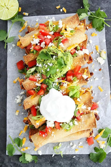 Black Bean Cheese Taquitos-These Vegetarian Taquitos Make A Great Party Appetizer Or Main Dish! Serve With All Of Your Favorite Toppings! #taquitos #blackbean #vegetarian #appetizer #vegetarianrecipe #easyrecipe #glutenfree Taquitos Vegetarian, Baked Taquitos, Two Peas And Their Pod, Vegetarian Party Food, Vegetarian Party, Taquitos Recipe, Vegetarian Mexican, Lasagna Recipes, Crowd Pleasing Recipes