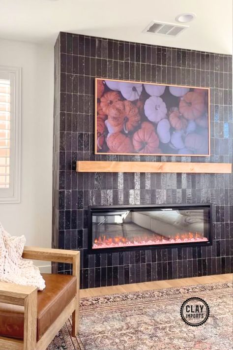 black thin brick fireplace with pumpkin artwork Black Fireplace Tile, Subway Tile Fireplace, Brick Wall Fireplace, Painting Brick Fireplace Black, Brick Fireplace Black, Black Mantle Fireplace, Black Tile Fireplace, Painting Brick Fireplace, Fireplace Painting