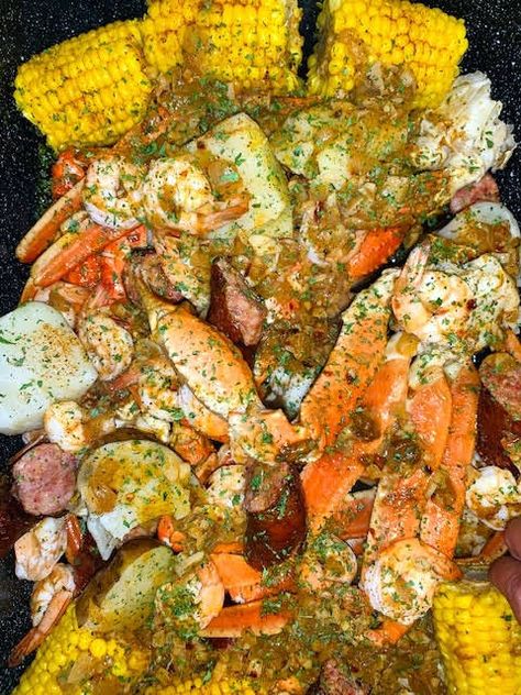 GARLIC BUTTER SEAFOOD BOIL with Crab Legs, Shrimp, Andouille Sausage, Corn on the Cob, Baby Red Potatoes, Old Bay Seasoning, Lemon, Bay Leaves, Garlic, Onion, Lemon, Butter, Olive Oil, Chicken Broth, Tabasco Sauce, Old Bay Seasoning, Paprika, Cayenne Pepper, Red Pepper Flakes, Lemon Pepper Seasoning. Garlic Butter Seafood Boil, Garlic Butter Seafood, Seafood Boil Seasoning, Andouille Sausage Recipes, Seafood Boil Recipes, Seafood Sauce, Boiled Food, Crab Boil, Appetizers For A Crowd