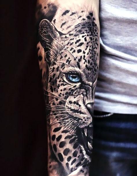 Amazing cheetah with blue eyes sleeve. Style: Realistic. Tags: Best, Beautiful, Awesome Snow Leopard Tattoo, Goa Tattoo, Cheetah Tattoo, Jaguar Tattoo, Leopard Tattoos, Petit Tattoo, Full Sleeve Tattoo Design, Blackout Tattoo, Tattoo Henna