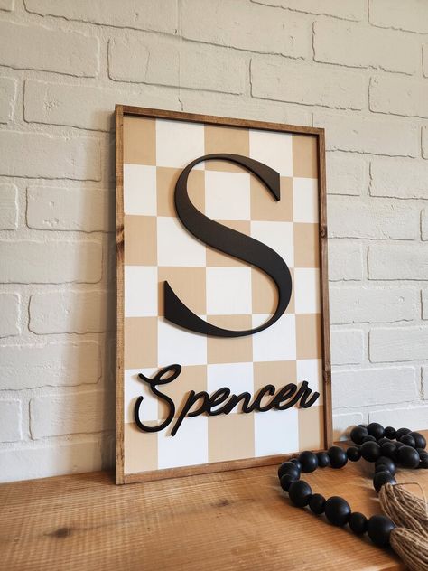 Framed wood initial sign with checkered background and raised initial and name. Checkered Nursery, Nursery Name Sign Boy, Big Boy Room Decor, Summer Wood Sign, Checker Background, Canvas Banners, Boy Room Decor, Checkered Background, Nursery Room Art