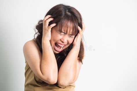 Asian adult woman screaming. Portrait on white background with d. Asian adult woman holding hands on head and screaming. Portrait on white background with copy royalty free stock photos Person Covering Ears With Hands, Screaming Woman Reference, Gripping Head Pose, Person Screaming Reference Photo, Hands In Head Pose, Hand On Head Reference Drawing, Stressed Pose Reference, Scared Pose Reference Photography, Hands Covering Ears Reference