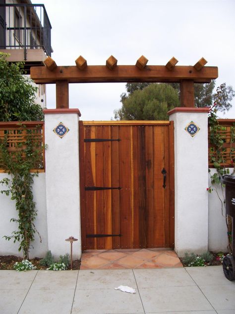 Spanish Style Fence Ideas, Spanish Style Privacy Fence, Spanish Gate Entrance, Spanish Style Exterior Doors, A Frame Curb Appeal, Spanish Fences And Gates, Spanish Style Driveway Gate, Spanish Style Gates Entrance, Spanish Style Mailbox Ideas