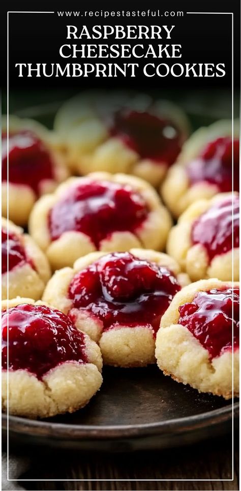 Soft, buttery cookies filled with creamy cheesecake and sweet raspberry preserves, these thumbprint cookies are perfect for any occasion! The combination of the rich, buttery cookie base, the smooth cheesecake filling, and the tangy raspberry preserve center makes these cookies a crowd-pleaser every time. Cream Cheese Raspberry Thumbprint Cookies, Prize Winning Cookies, Raspberry Cheesecake Thumbprint Cookies, Raspberry Cookies Recipes, Raspberry Filled Cookies, Cheesecake Pudding Cookies, Mini Raspberry Cheesecake, Rasberry Cheesecake, Cheesecake Thumbprint Cookies