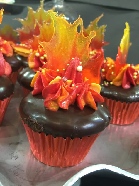 Fire cupcakes Fire Themed Snacks, Lava Party Ideas, Elemental Themed Food, Fire Themed Food, Elemental Movie Food Ideas, Flame Cupcakes, Volcano Cupcake Cake, Fire And Ice Cupcakes, Fire And Ice Cake Ideas