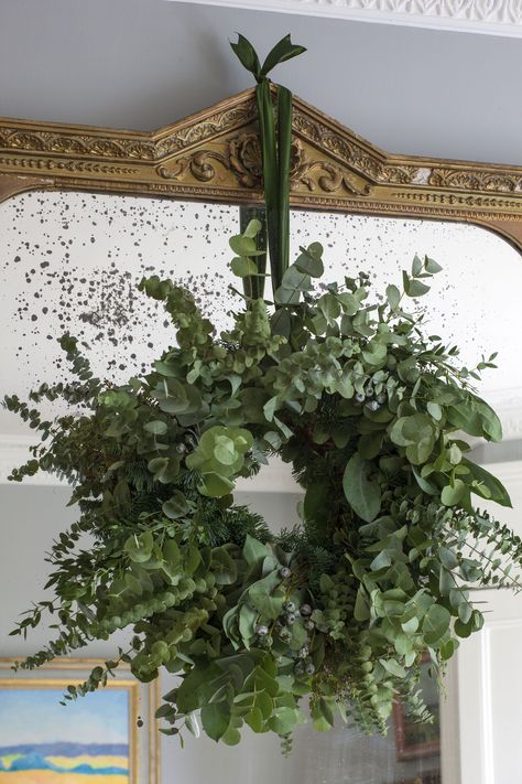 Garland Over Mirror Christmas Decor, Wreath Hanging Mirror, Wreathe On Mirror, Christmas Greenery Around Mirror, Wreath On Mirror Ideas, Large Christmas Wreath For Wall, Wreath Over Fireplace, Wreaths On Mirrors, Winter Garland Around Mirror