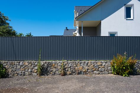 Couple Uses Corrugated Metal Roof Panels to Make Stunning Backyard Fence Corrugated Fence, Building Texture, Mini Shed, Corrugated Metal Fence, Corrugated Metal Wall, Metal Roof Panels, Corrugated Tin, Corrugated Metal Roof, Rock Fireplaces