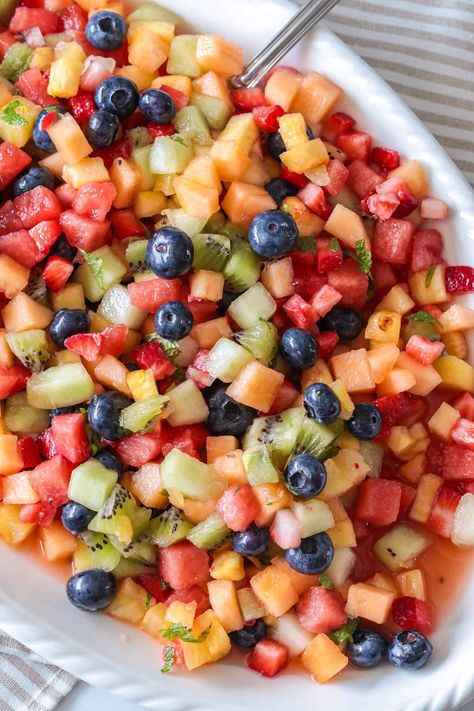 This fruit salad is flavored with honey lime and vanilla to make a deliciously fresh and sweet salad. Fruit Salad With Lime Dressing, Honey Yogurt Fruit Salad, Chopped Fruit Salad, Strawberry Fruit Salad, Honey Lime Fruit Salad, Chopped Fruit, Sweet Salad, Fruit Salad With Yogurt, Honey Lime Dressing