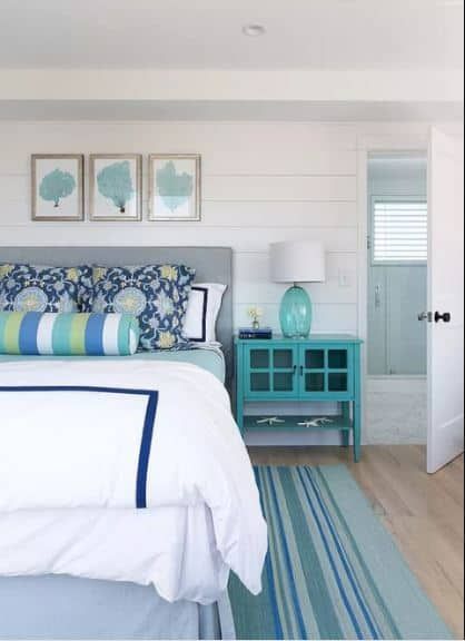 Whether you live by the ocean or you simply want to channel that feeling in your bedroom, a beach bedroom is a fantastic way to have a relaxed and ser... | Follow the Nautical and Coastal Color Scheme #BeachBedroom #Bedrooms #BeachThemedBedroom #BedroomDecor #HomeDecor #DecoratedLife Beach Cottage Bedroom, Coastal Style Bedroom, Ocean Bedroom, Beach Style Bedroom, Bedroom Turquoise, Beach House Bedroom, Beach Bedroom Decor, Coastal Room, Rustic Coastal