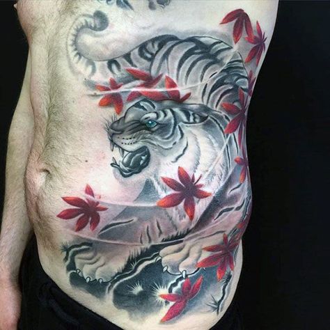 Gentleman With Japanese And Red Maple Leaves Rib Cage Side Tattoo Japanese Rib Tattoo, Tiger Tattoo Designs, Japanese Tattoo Meanings, Thigh Piece Tattoos, Rib Tattoos For Guys, Japanese Tiger Tattoo, Japanese Tattoos For Men, Japanese Tiger, Tiger Tattoo Design