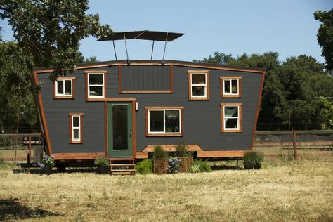 This is a 200 sq. ft. tiny house on wheels located in Walnut Creek, CA. It’s designed by Brian Crabb of Viva Collectiv. Enjoy! The Schooner Tiny House on Wheels with ‘Secret’ Roof… Mod House, Slanted Walls, Tiny House Luxury, Entry Doors With Glass, Tiny House Inspiration, Rooftop Patio, House Deck, Casa Container, Walnut Creek