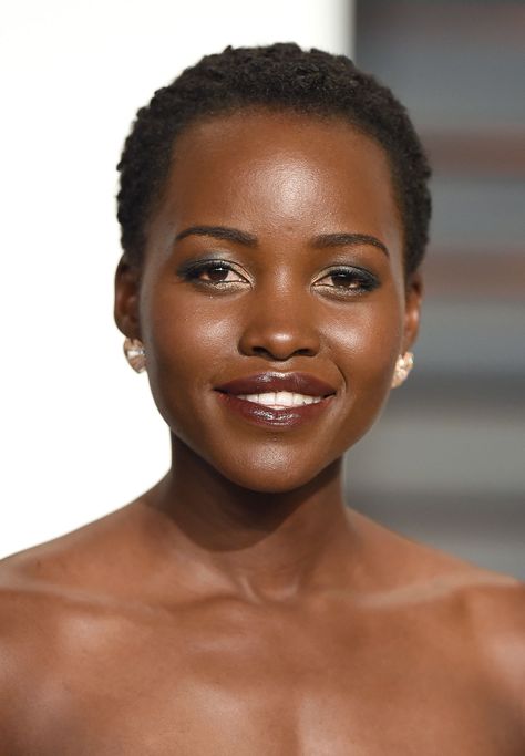 It's no secret that Lupita Nyong'o loves beauty products, so it makes sense that she loves showing off all those fun eyeshadow looks and pretty lipstick shades with her trademark cropped cut.  - GoodHousekeeping.com Black Haircut Styles, Short Hair Styles African American, Short Afro Hairstyles, Black Women Short Hairstyles, Short Black Hair, Natural Hair Cuts, Short Haircut Styles, American Hairstyles, Natural Afro Hairstyles